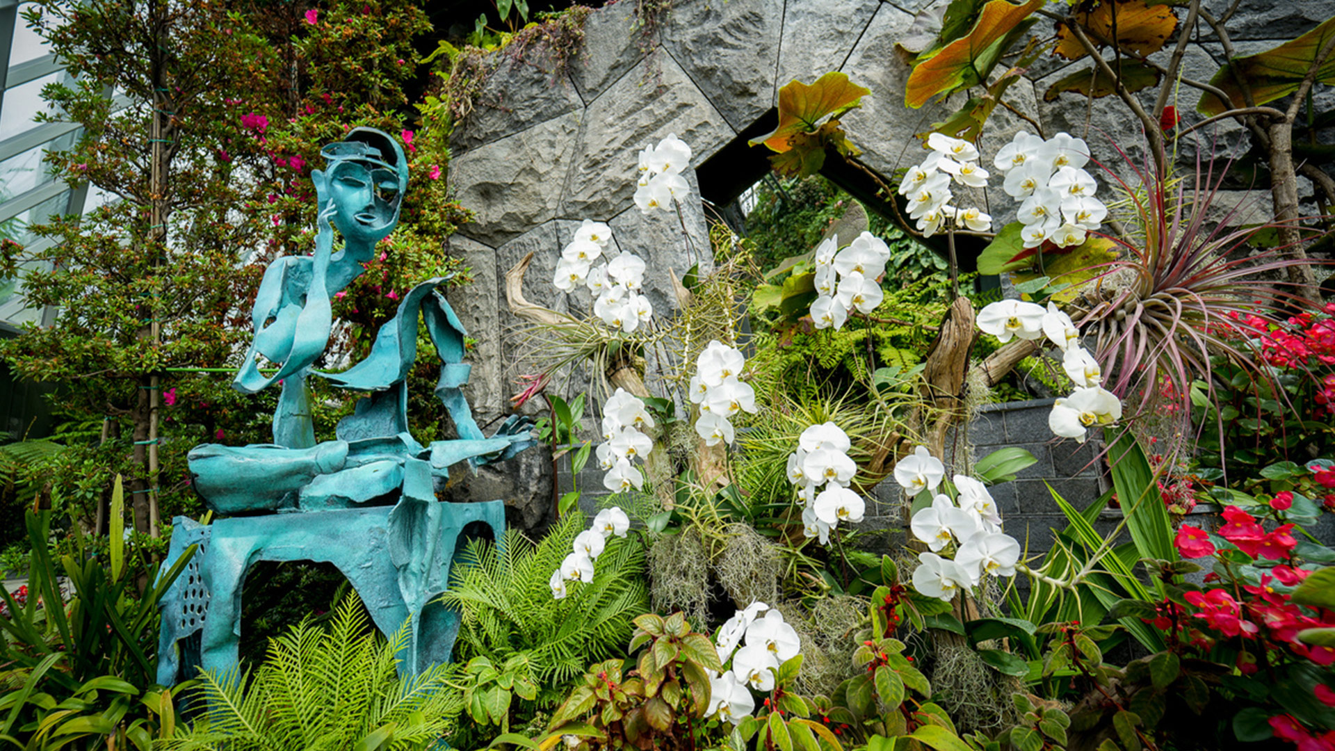 The Discovery Garden at T1 features tree-like sculptures and