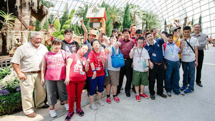 MINDS beneficiaries touring the Flower Dome with Minister for National Development Mr Khaw Boon Wan (centre). Also in the photo are CEO of Gardens by the Bay Dr Kiat W. Tan (extreme left) and CEO of MINDS Mr Keh Eng Song (extreme right).