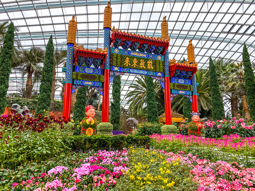 The seven-metre-tall 'Auspicious Omens' archway flanked by 'Golden Boy and Jade Girl' in the Dahlia Dreams floral display at Gardens by the Bay