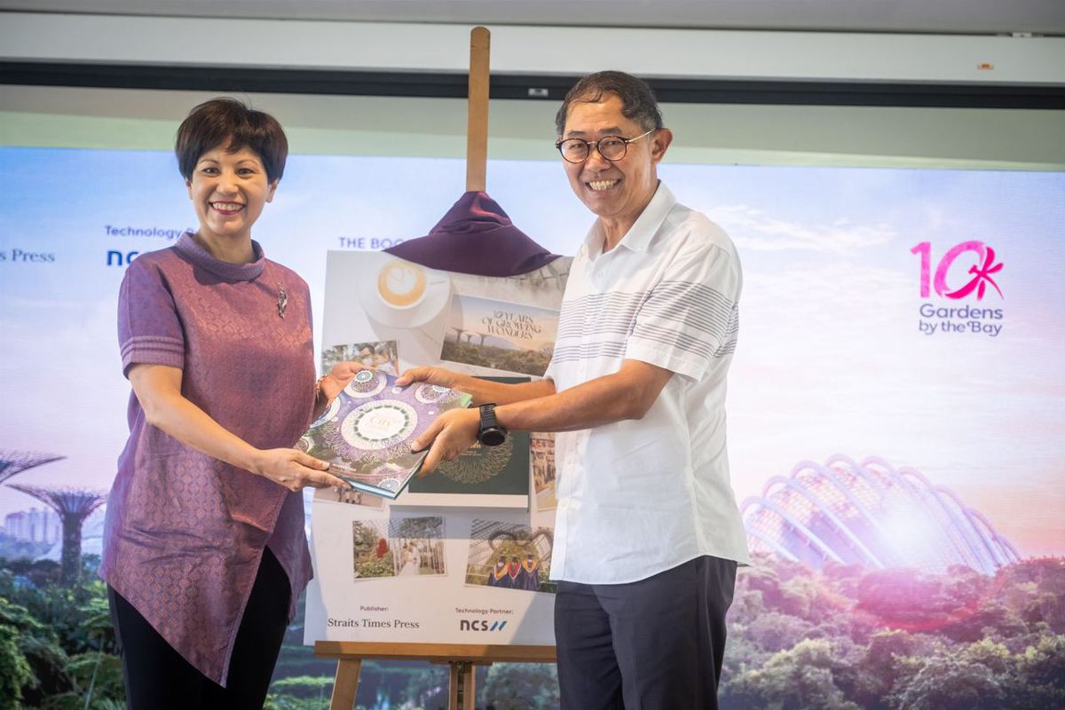 Minister in the Prime Minister's Office, and Second Minister for Finance and National Development Indranee Rajah, and Chairman of Gardens by the Bay Niam Chiang Meng launch Gardens by the Bay’s 10th anniversary coffee table book “A Blossoming City Garden".