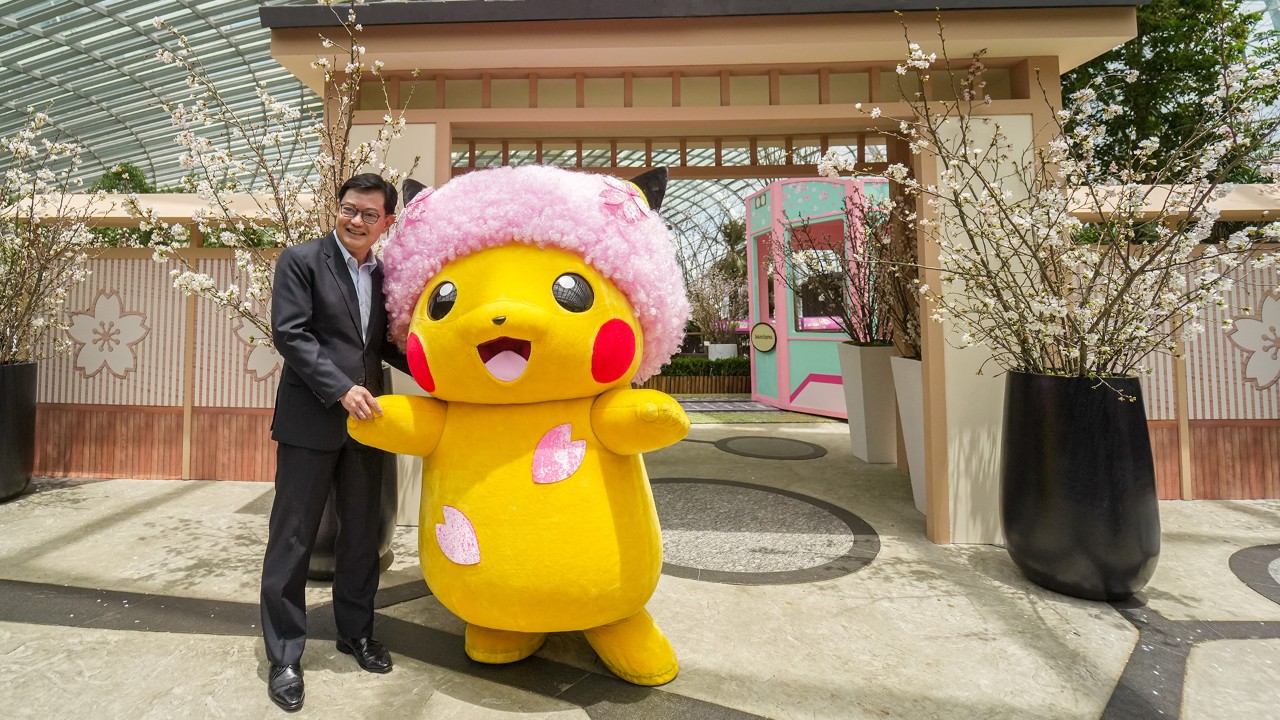Deputy Prime Minister and Coordinating Minister for Economic Policies Heng Swee Keat meeting Sakura Afro Pikachu in its first overseas appearance, at the Sakura floral display at Gardens by the Bay.