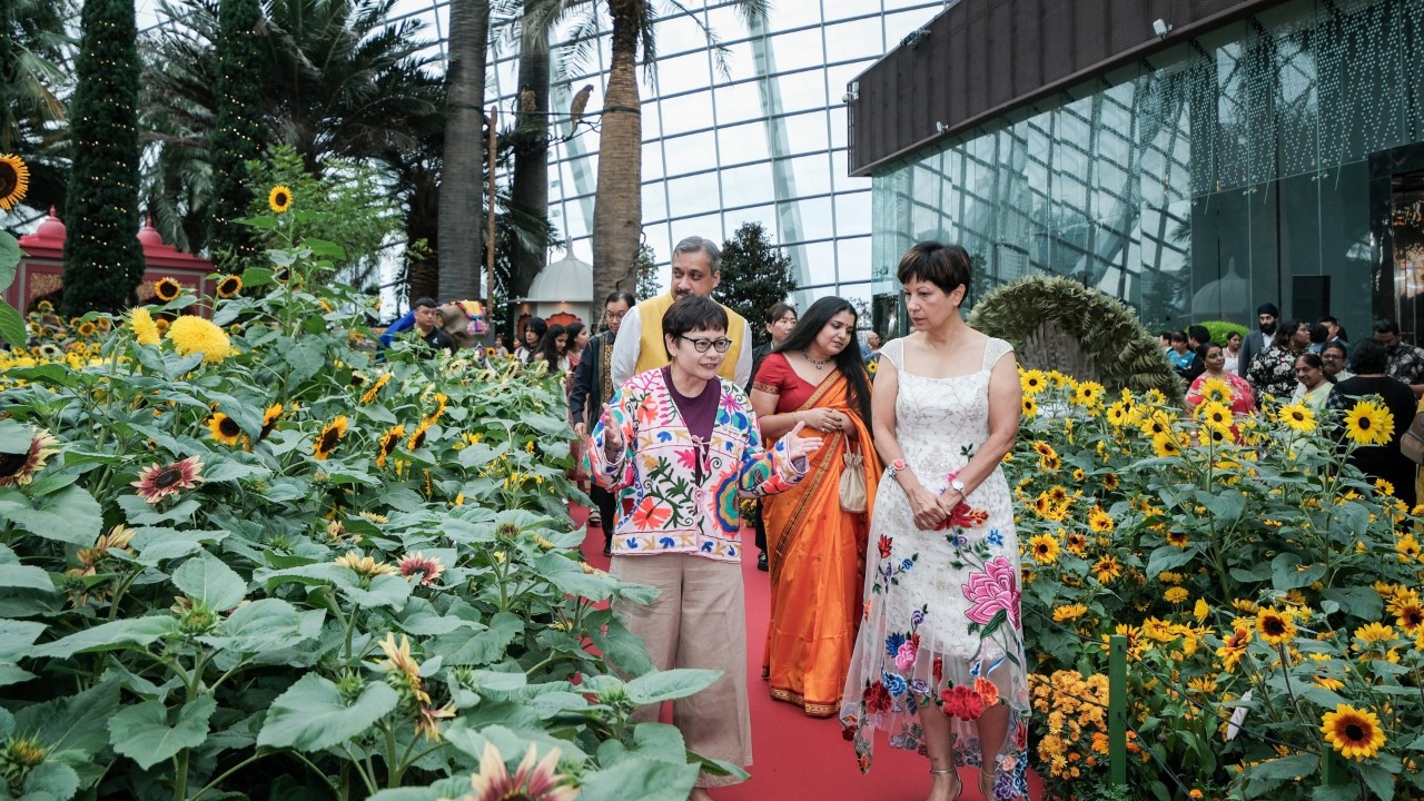 Gardens by the Bay’s Deputy Director of Conservatory Operations Ms Melissa Tan takes Minister in the Prime Minister’s Office and Second Minister for Finance and National Development Ms Indranee Rajah on a guided tour of the Sunflower Surprise floral display in Flower Dome. They are accompanied by the High Commissioner of India to Singapore His Excellency Dr Shilpak Ambule and his spouse Mdm Mayuri Ambule.
