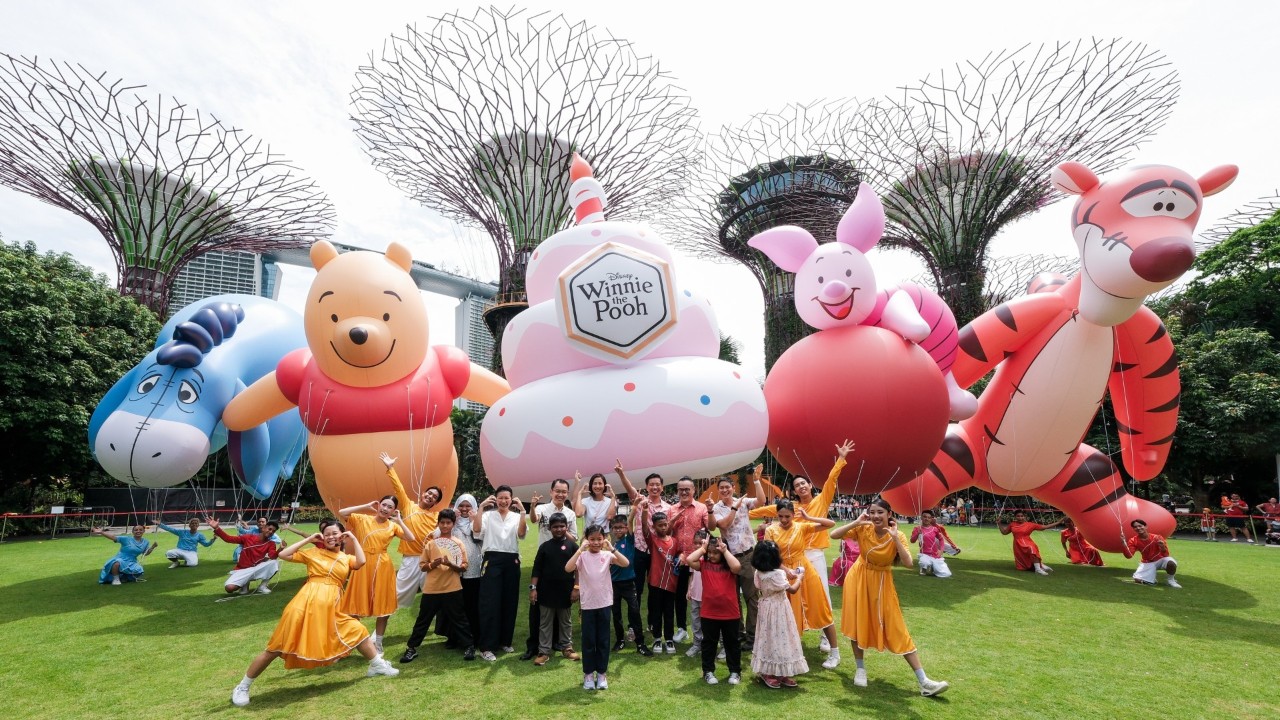 From left to right: Ms Geraldine Naidu, Director of Brand Commercialisation and Market Lead, Singapore, Disney Consumer Products, The Walt Disney Company, Mr Felix Loh, Chief Executive Officer, Gardens by the Bay, Mr Alvin Tan, Minister of State, Ministry of National Development and Ministry of Trade and Industry, Ms Jean Ng, Assistant Chief Executive, Experience Development Group, Singapore Tourism Board, and Mr Sam Liew, Board Director, Gardens by the Bay celebrating the launch of Children’s Festival 2026 with performers from Pooh’s Grand Friendship Party.