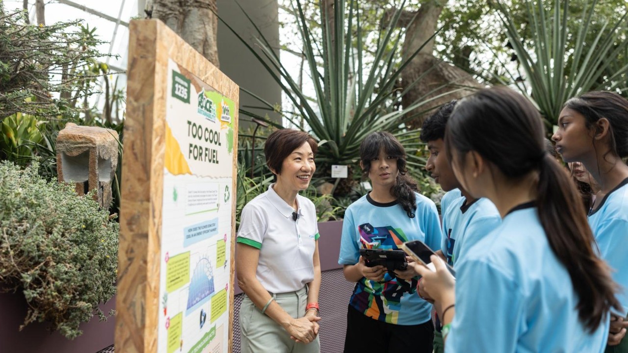 Minister for Sustainability and the Environment Ms Grace Fu interacts with students from Jurongville Secondary School during the Race to Sustainability! school race in Flower Dome today.
