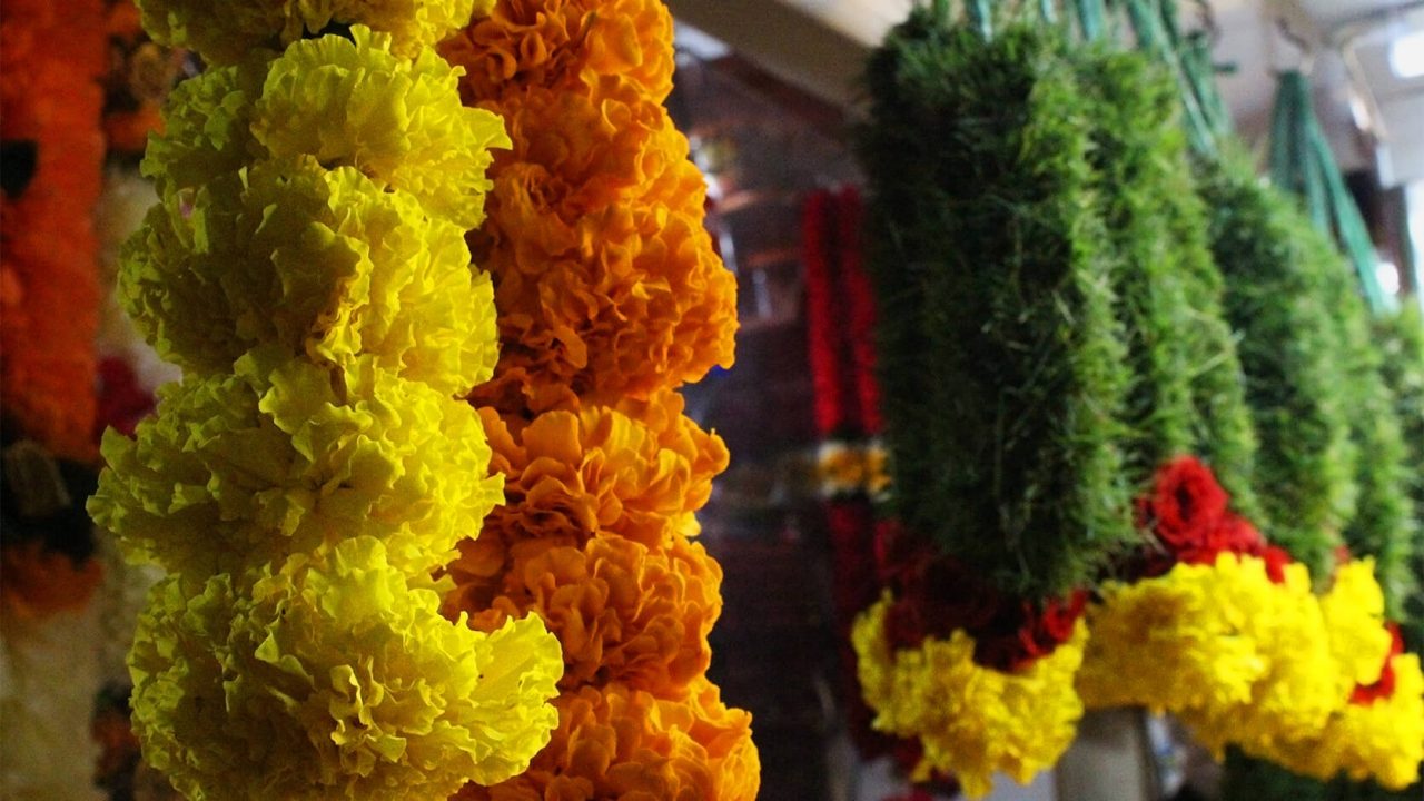 Garlands of Mexican marigolds (left) being sold at Little India, Singapore.